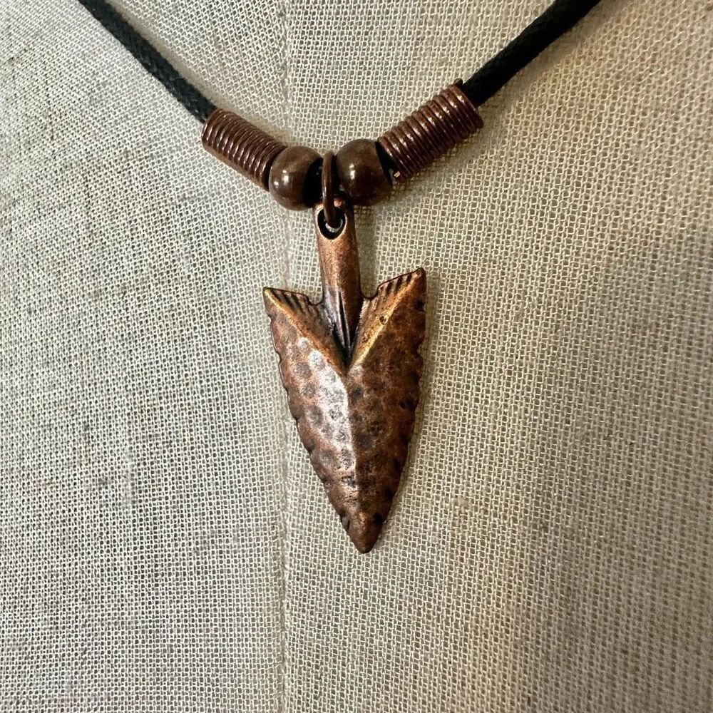 copper tone arrowhead pendant necklace on black cord